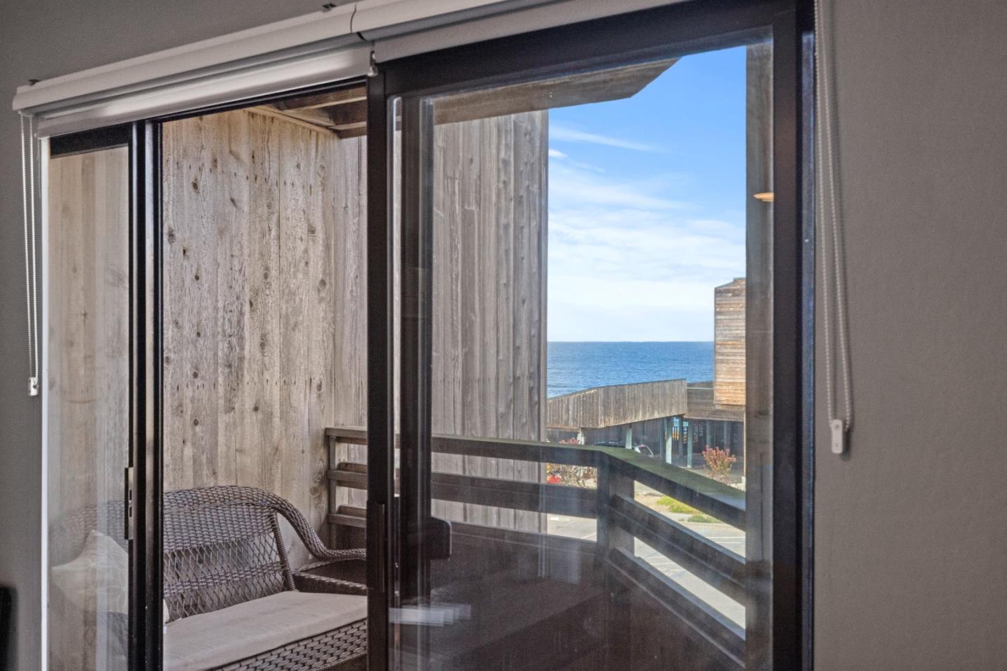 125 Surf Way, Unit 305 Monterey, CA 93940 - Photo 12 of 27 a view of a balcony with wooden floor