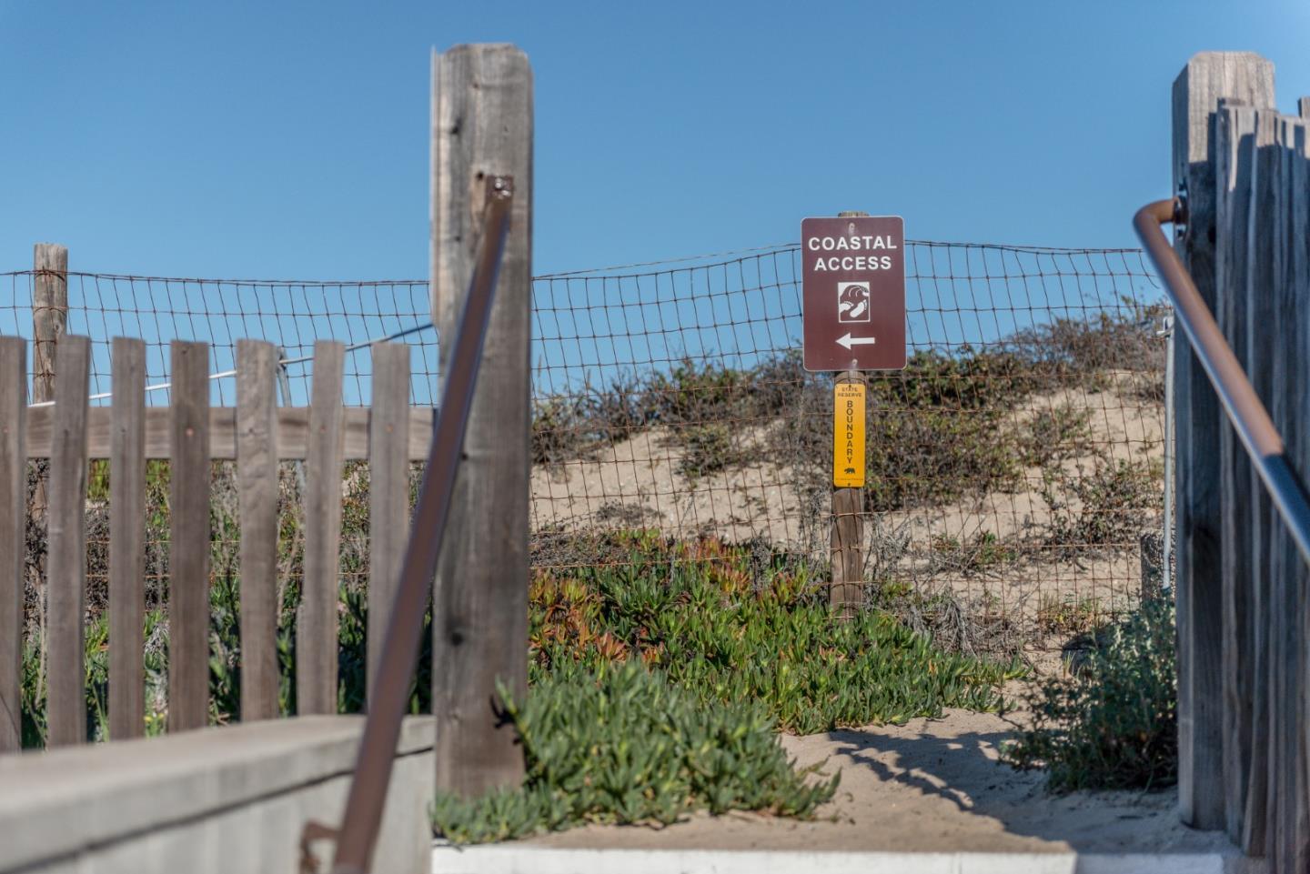 125 Surf Way, Unit 305 Monterey, CA 93940 - Photo 24 of 27 a view of a balcony with a fence