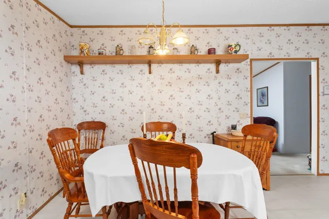 a view of a dinning room with furniture and wooden floor