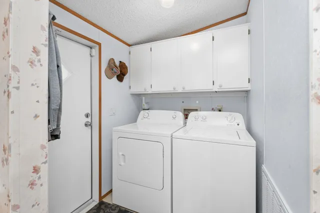 a view of storage and utility room with washer and dryer