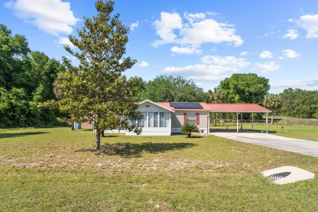 a house with swimming pool in front of it