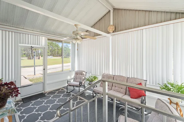 a balcony with furniture and window