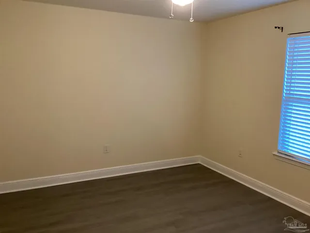 a white toilet and tub next to a bathroom sink