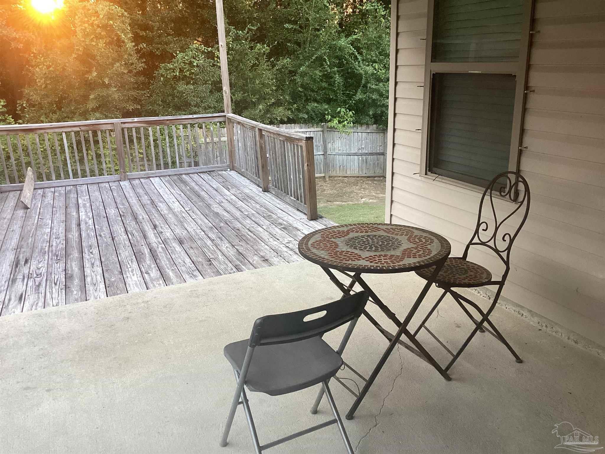 196 Millet Circle Cantonment, FL 32533 - Photo 6 of 20 a view of balcony with table and chairs