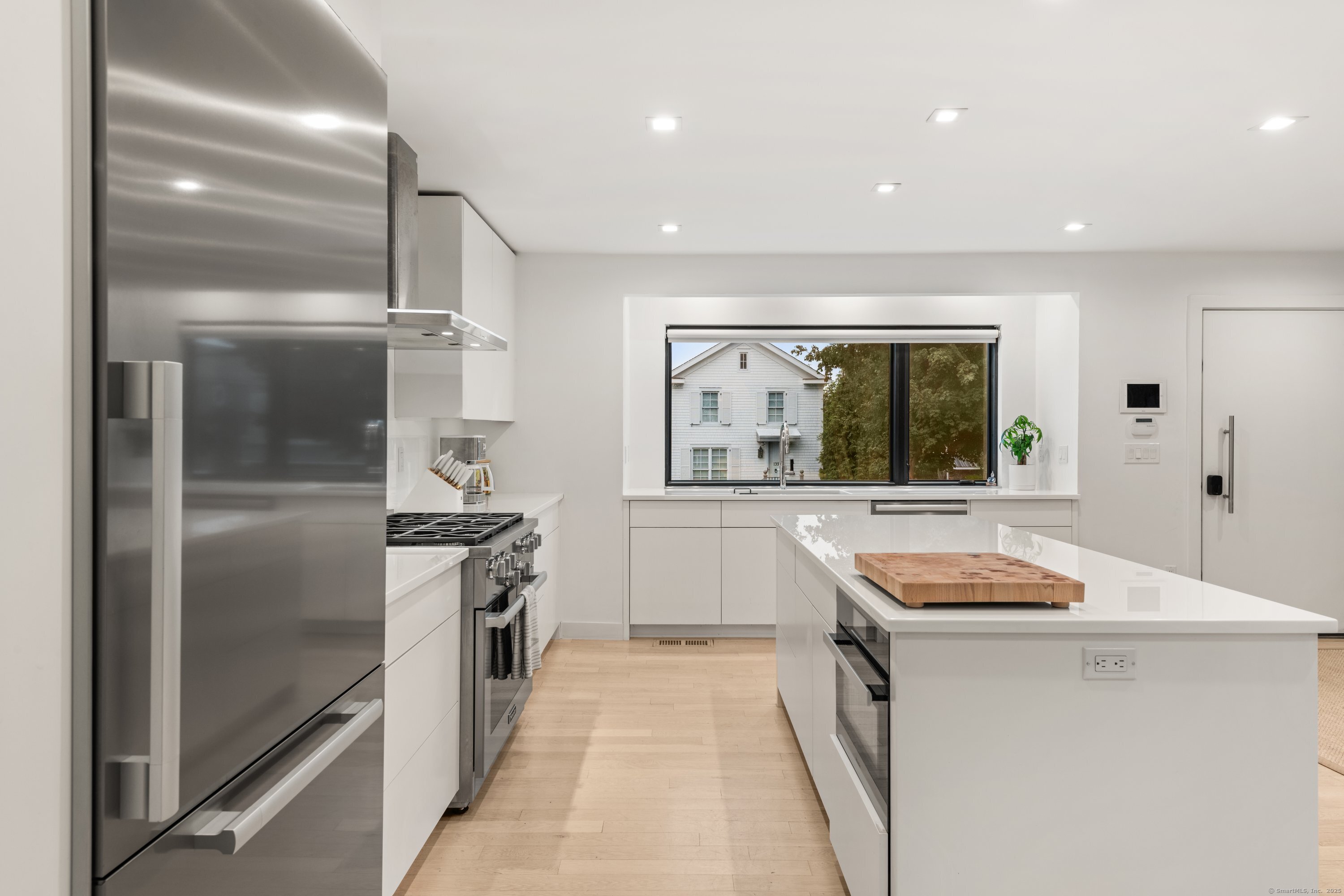 200 Hillspoint Road Westport, CT 06880 - Photo 14 of 37 a kitchen with stainless steel appliances granite countertop a stove a sink and a refrigerator