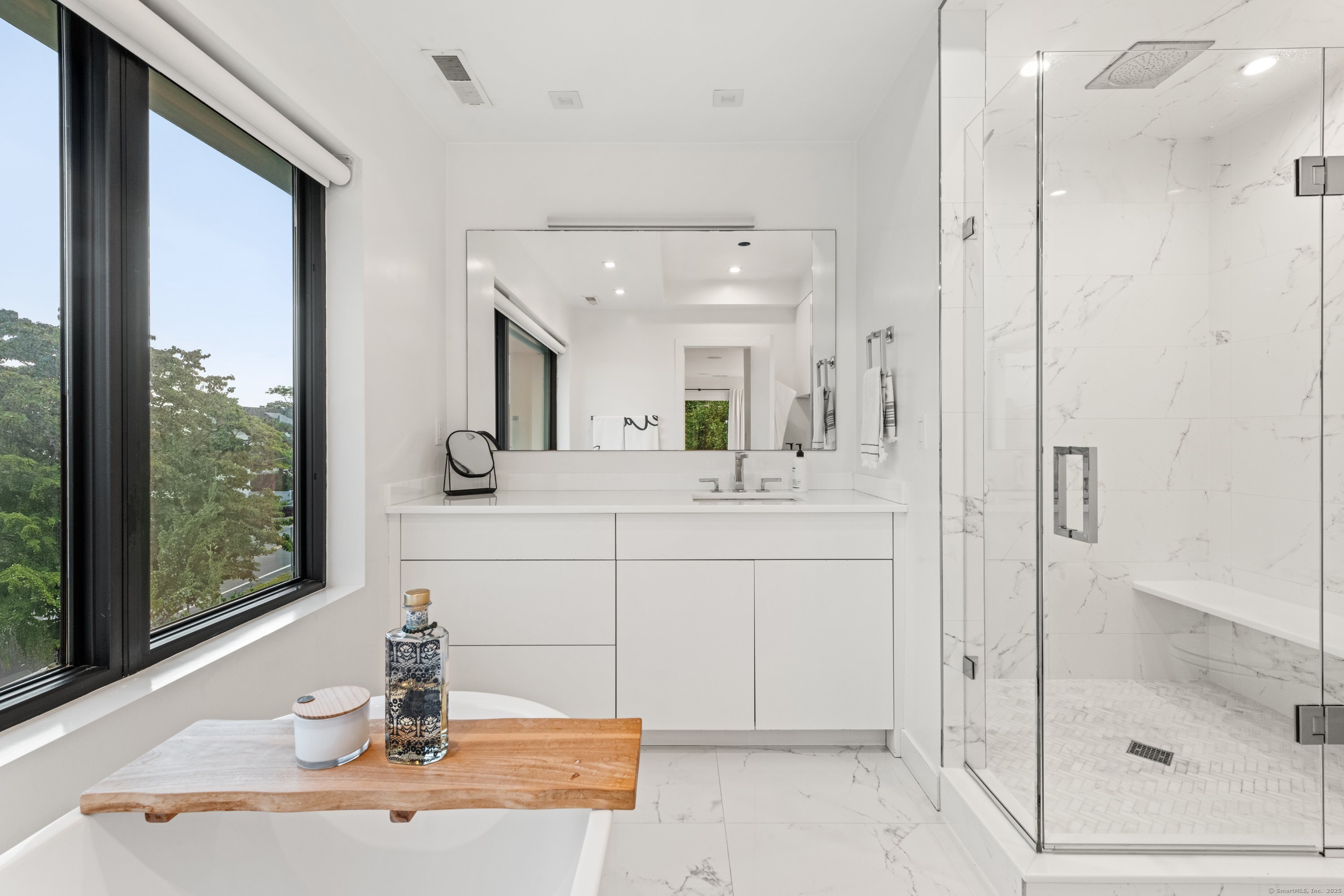 200 Hillspoint Road Westport, CT 06880 - Photo 27 of 37 a bathroom with a sink and a mirror