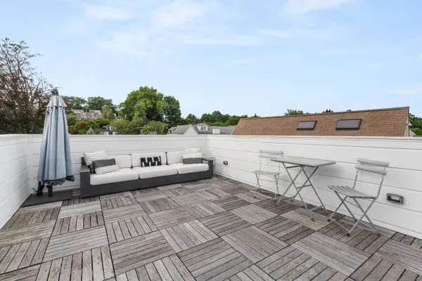 a view of roof deck with seating space