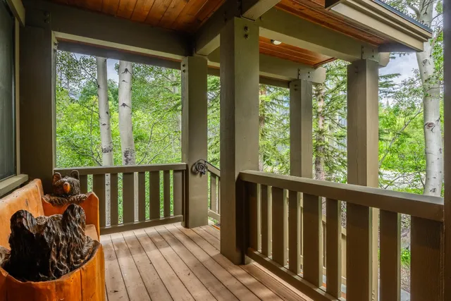 a view of a balcony with wooden floor