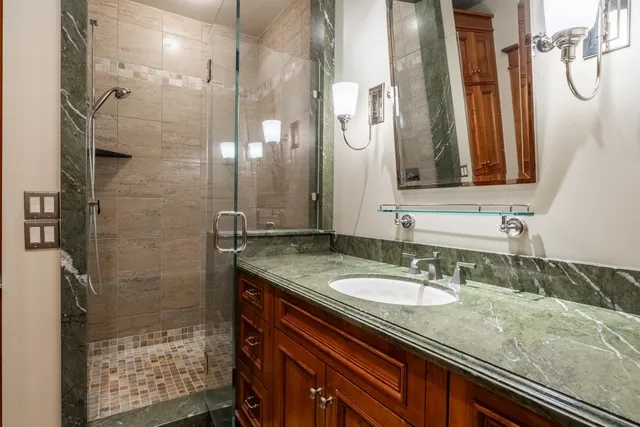 a bedroom with a bed and a mirror