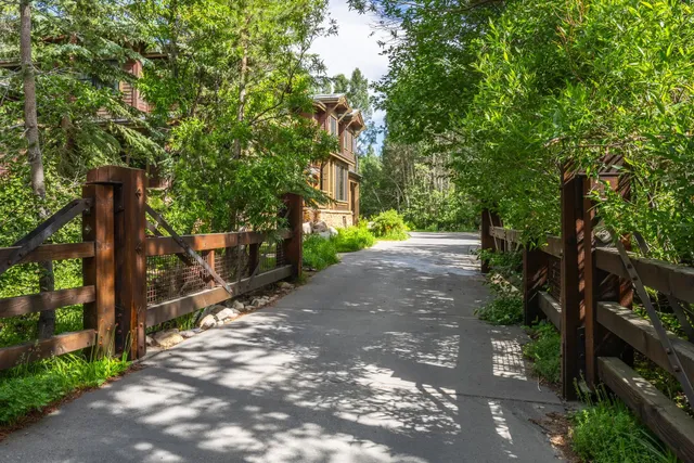 a pathway of a house with a trees