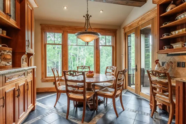 a view of a dining room with furniture window and outside view
