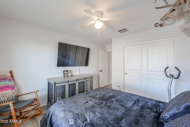 a bedroom with a bed and a desk