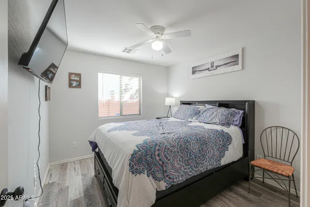 a bedroom with a bed and window