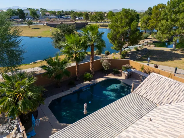 a view of a swimming pool with a patio