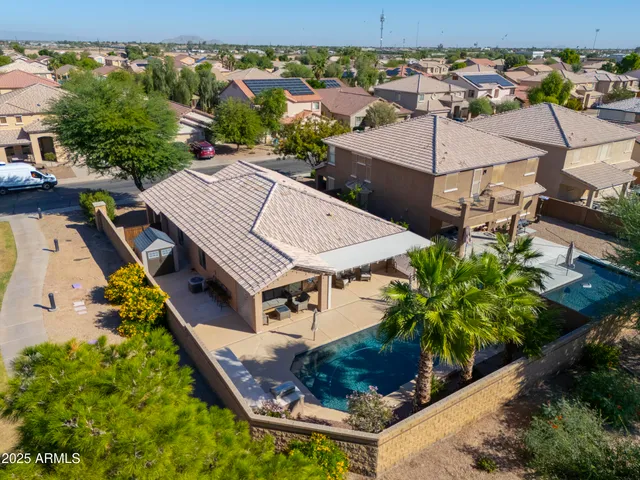 an aerial view of a house with a garden