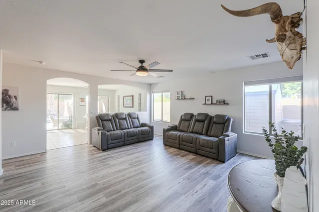 a living room with furniture and a large window