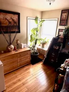 a view of a living room with furniture and a flat screen tv