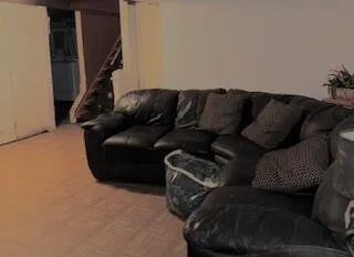 a living room with furniture and a couch