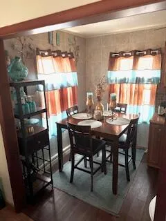 a view of a dining room and a table chairs