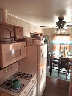 a kitchen with stainless steel appliances granite countertop a stove and a refrigerator