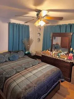 a bedroom with a bed and a mirror