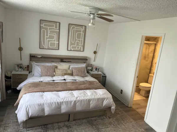 a bedroom with a bed and a mirror