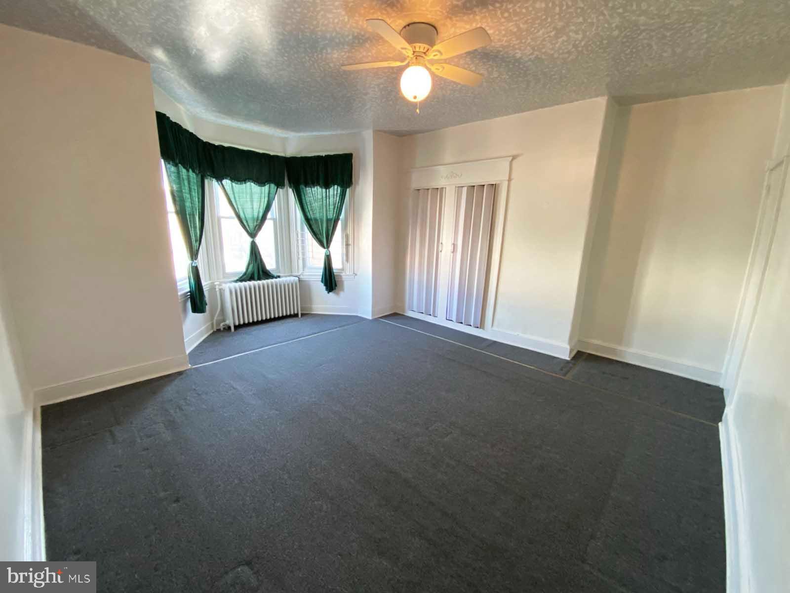 538 West Pike Street Philadelphia, PA 19140 - Photo 13 of 34 an empty room with windows and outdoor view