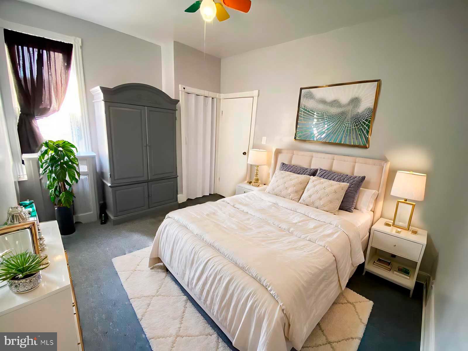 538 West Pike Street Philadelphia, PA 19140 - Photo 15 of 34 a bedroom with a bed and a painting on the wall