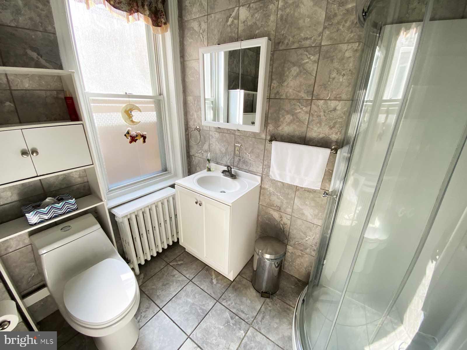 538 West Pike Street Philadelphia, PA 19140 - Photo 17 of 34 a bathroom with a sink toilet and shower