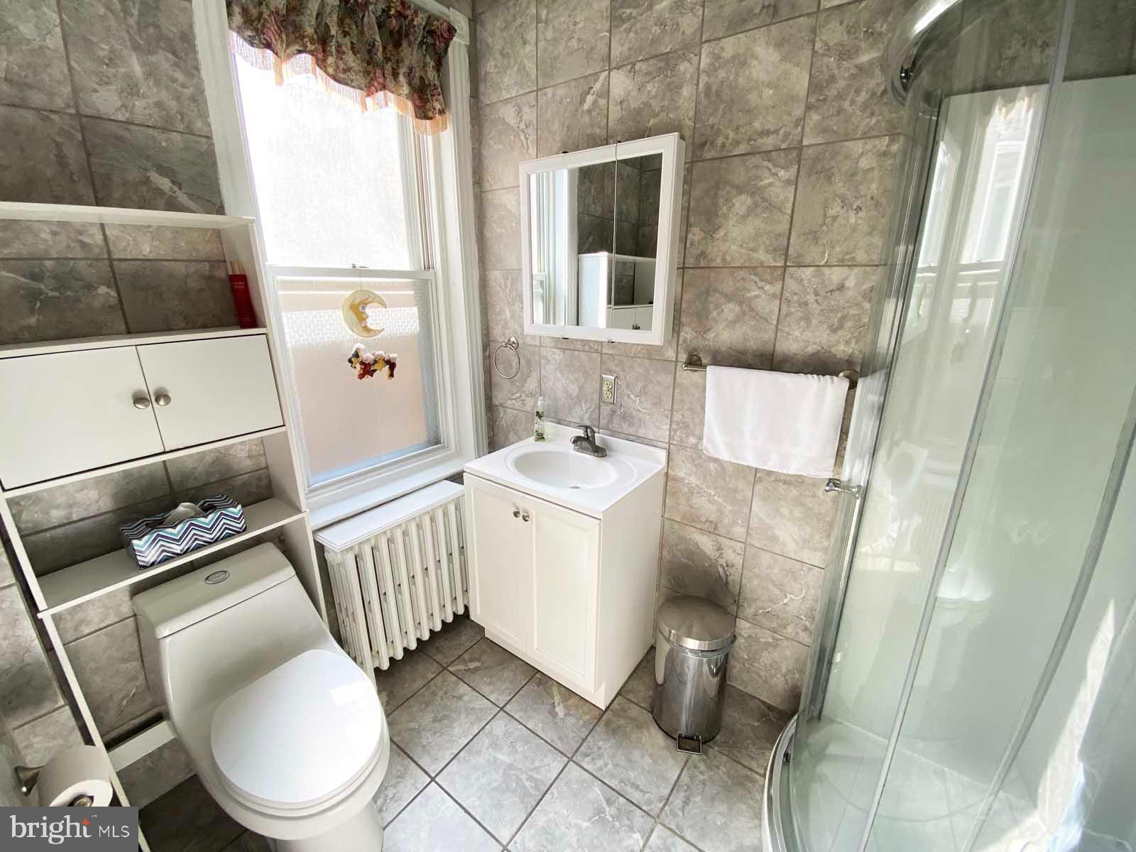 538 West Pike Street Philadelphia, PA 19140 - Photo 19 of 34 a bathroom with a sink toilet and shower