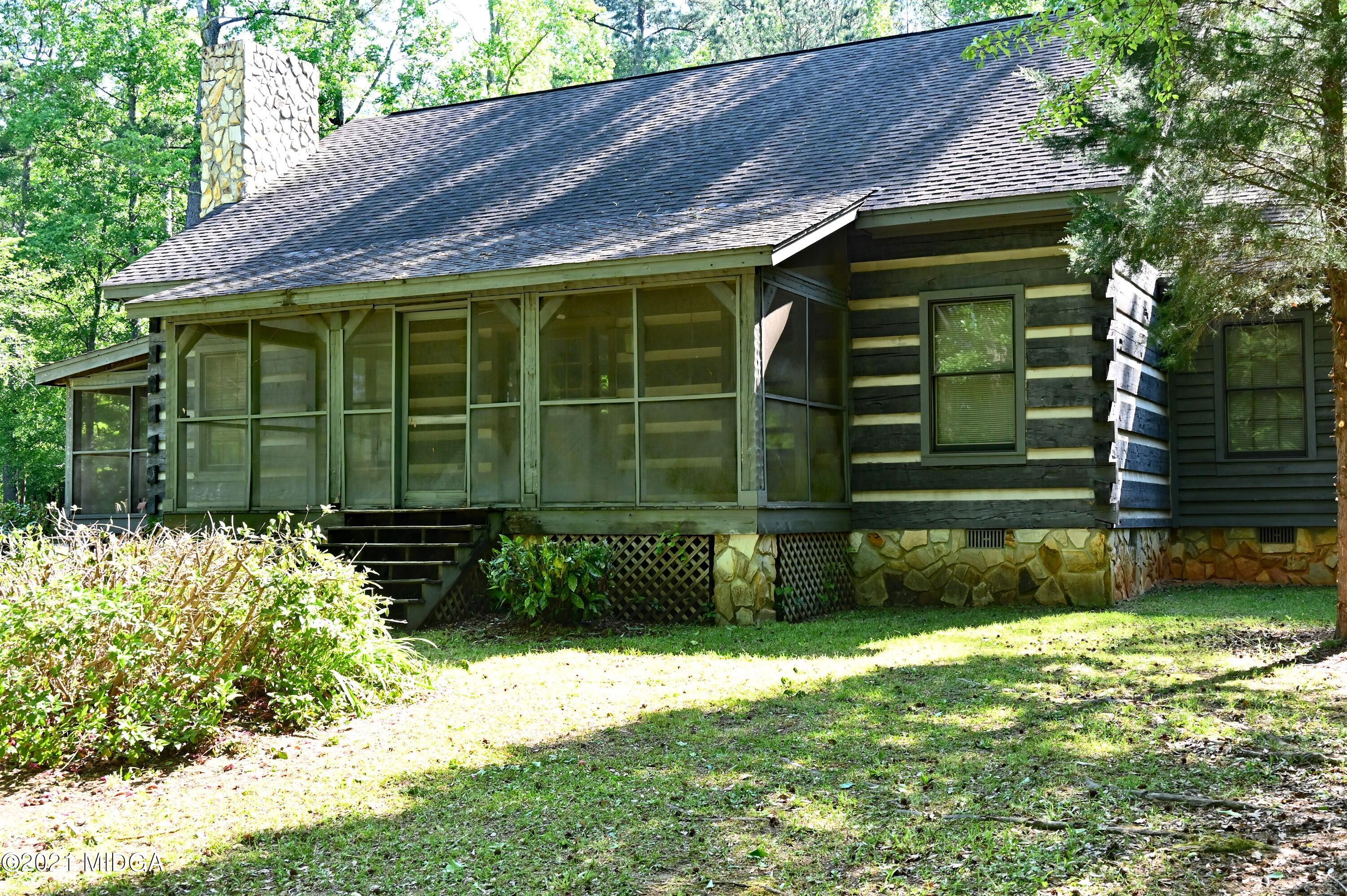10333 Estes Road Macon, GA 31210 - Photo 14 of 29 a front view of a house with a yard