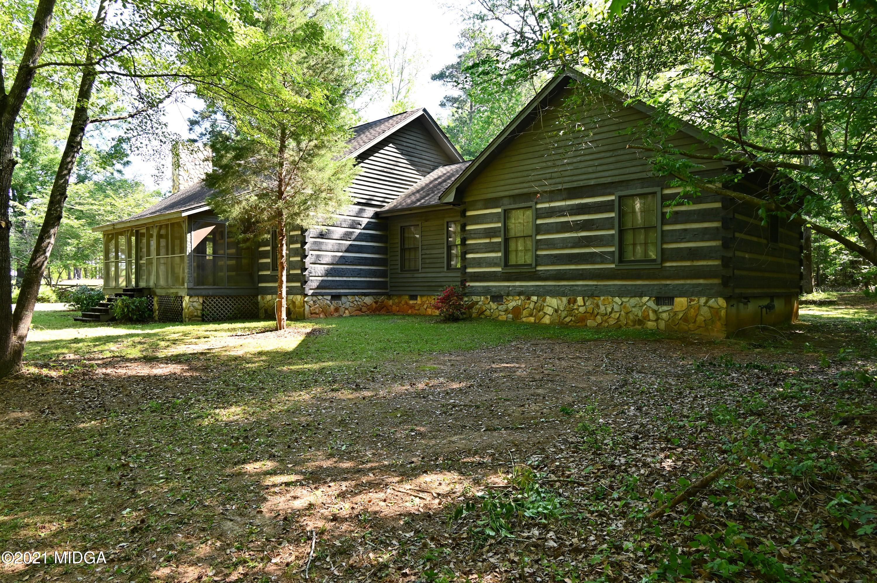 10333 Estes Road Macon, GA 31210 - Photo 16 of 29 a view of a house with a yard