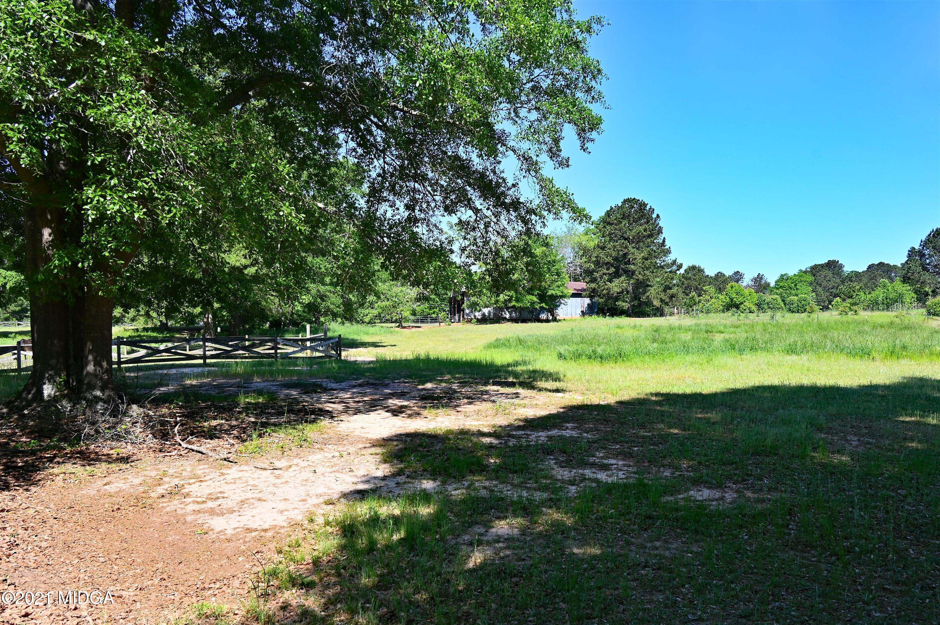 10333 Estes Road Macon, GA 31210 - Photo 23 of 29 a view of a golf course with a lake