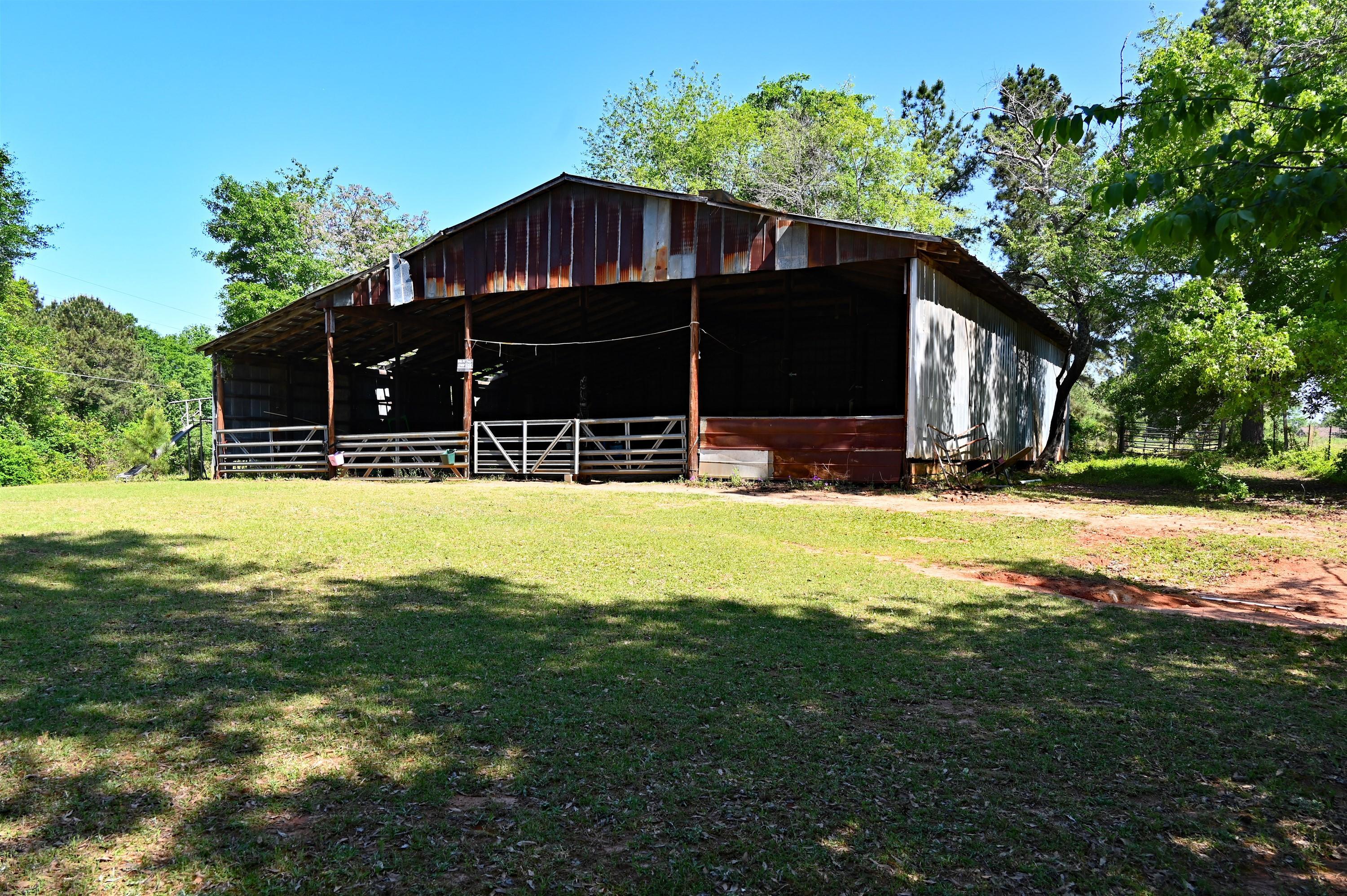 10333 Estes Road Macon, GA 31210 - Photo 29 of 29 a view of a house with a yard