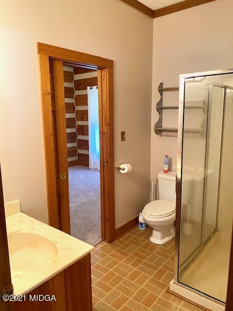 10333 Estes Road Macon, GA 31210 - Photo 8 of 29 a bathroom with a toilet and a shower