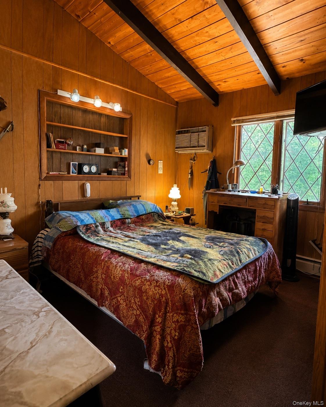 177 Davos Road Woodridge, NY 12789 - Photo 7 of 19 a bedroom with a bed next to a window