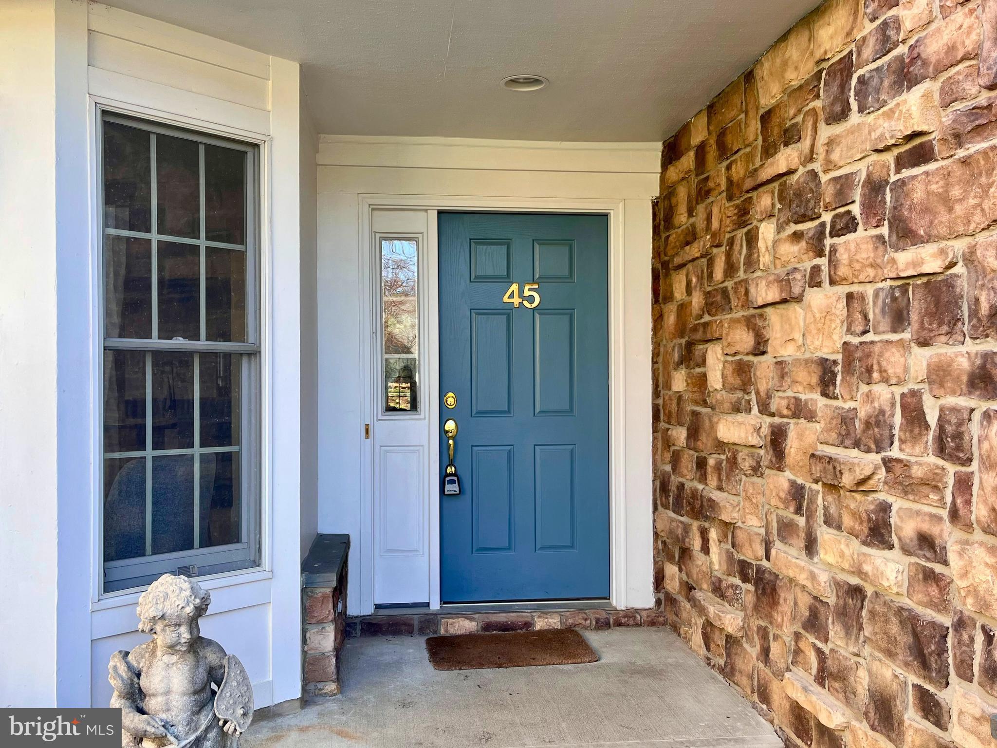 a view of front door with wooden door