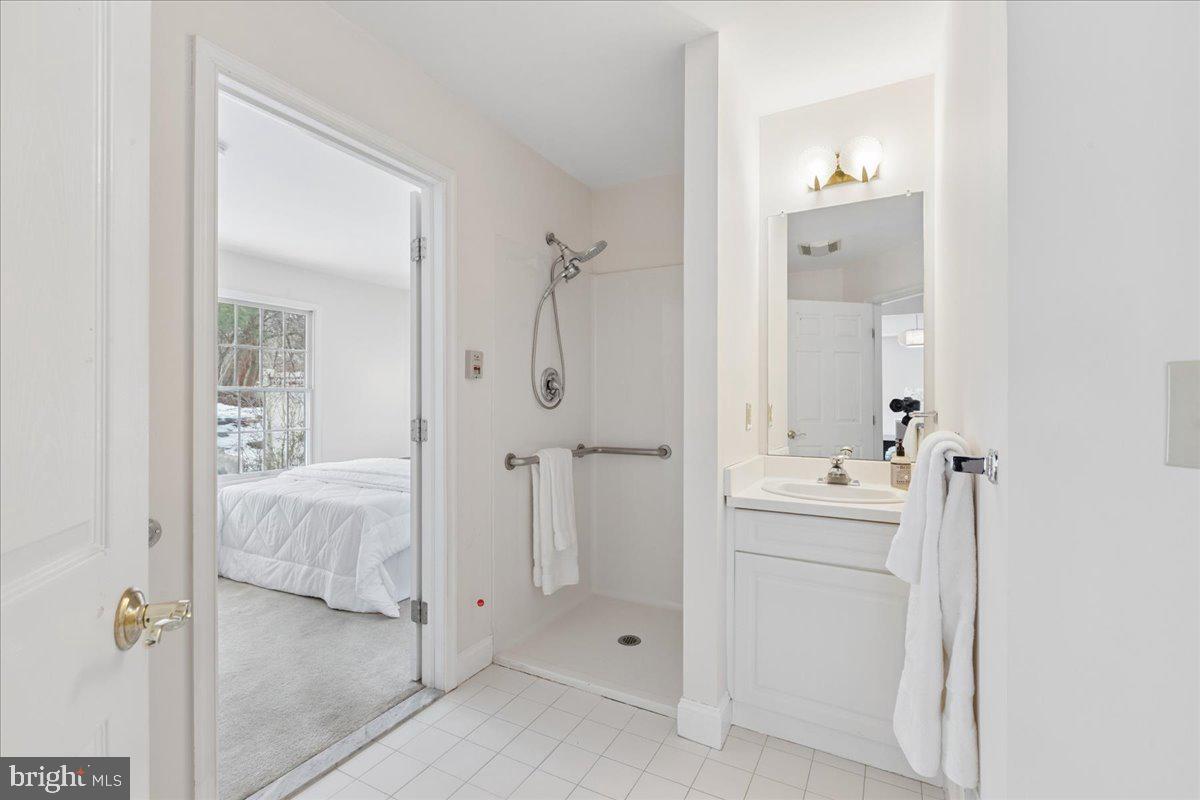 45 Hedge Row Road Princeton, NJ 08540 - Photo 17 of 29 a bathroom with a double vanity sink and mirror