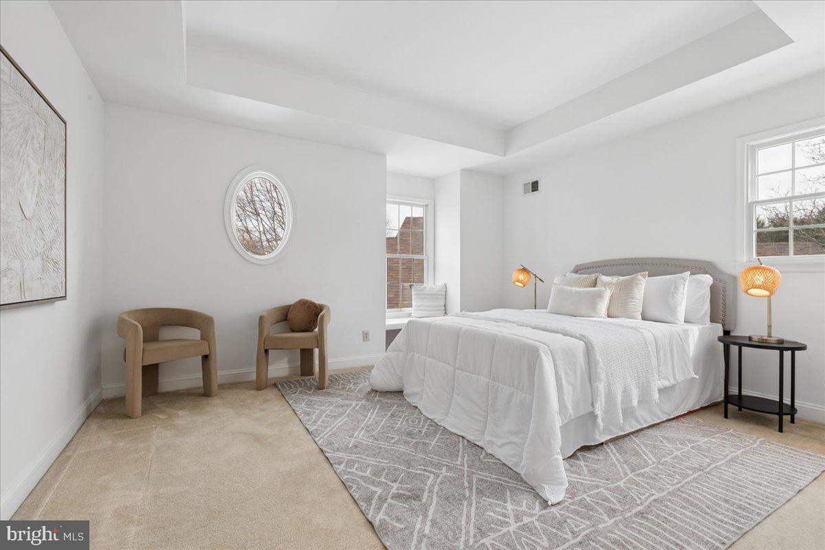 45 Hedge Row Road Princeton, NJ 08540 - Photo 21 of 29 a bedroom with a bed and a chandelier