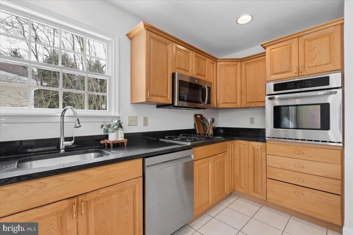 45 Hedge Row Road Princeton, NJ 08540 - Photo 7 of 29 a kitchen with granite countertop cabinets stainless steel appliances a sink and a window
