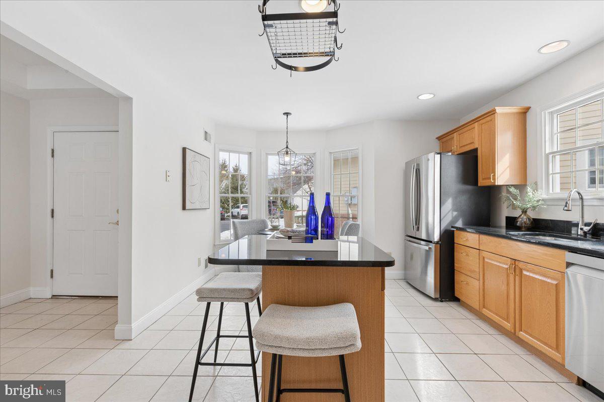 45 Hedge Row Road Princeton, NJ 08540 - Photo 8 of 29 a kitchen with stainless steel appliances kitchen island granite countertop a sink and cabinets