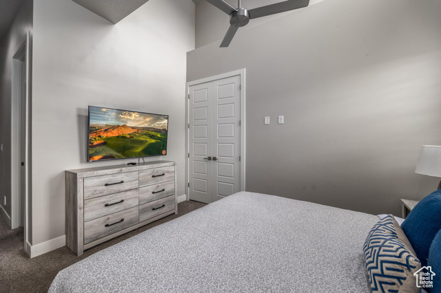 2600 Ocotillo Way, Unit 34 Santa Clara, UT 84765 - Photo 16 of 43 Bedroom with carpet, ceiling fan, and a high ceiling