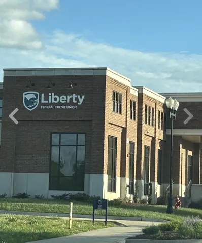 a view of outdoor space with signage and flags