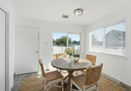 a kitchen with stainless steel appliances kitchen island granite countertop a sink and cabinets