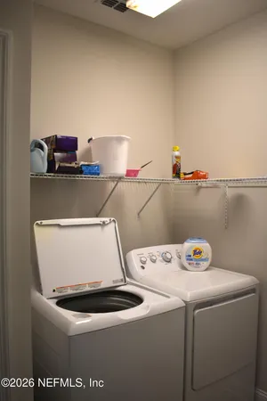 a utility room with dryer and washer
