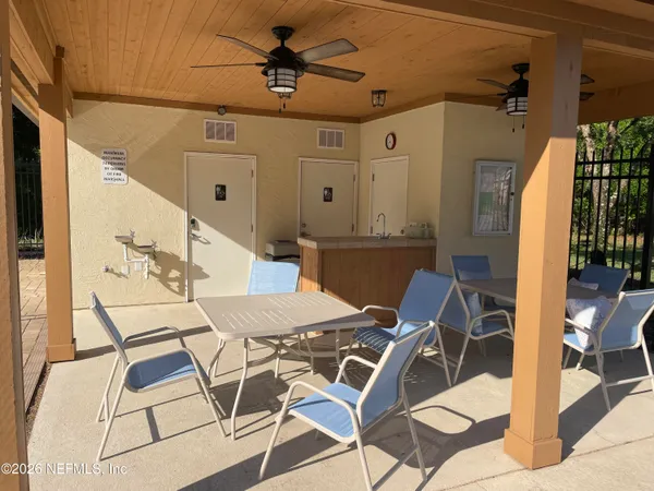 a view of a backyard with a patio