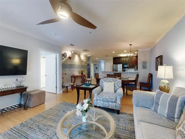a bedroom with furniture and a flat screen tv