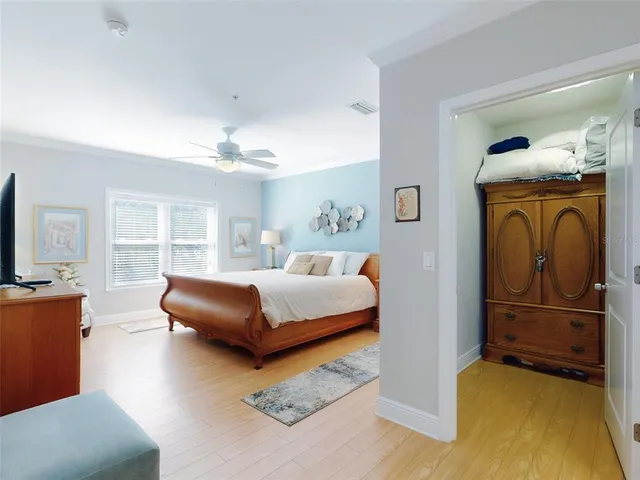 a bedroom with a bed couch and window