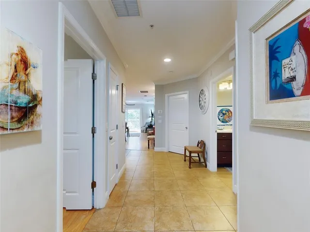 a bed sitting in a bedroom and book on top of a bed