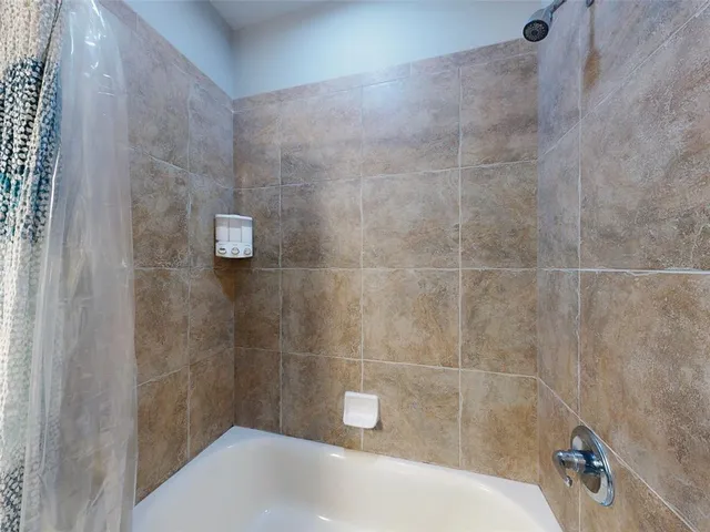 a view of a hallway with seating area